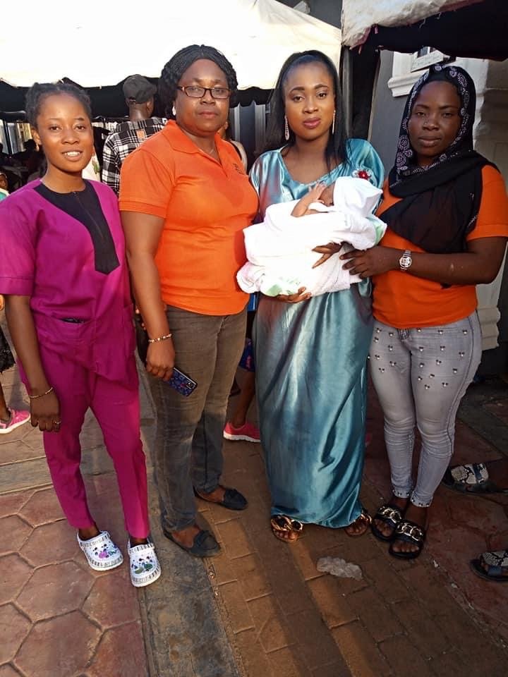 Gift Clinics Staff at a Client's naming ceremony to help the happy clients share in their Joy
